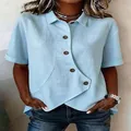 Detail view of light blue irregular button shirt showing linen fabric texture and cut - Sky Blue