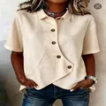 Camicia casual beige a maniche corte da donna con orlo anteriore irregolare alla moda - Taglia S / Top / Albicocca