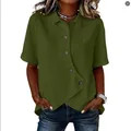 Close-up of olive green casual shirt with unique irregular hem and button detail - Green