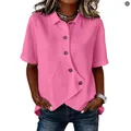 Detail of pink women's short sleeve linen shirt with unique asymmetrical hem design - Bright Pink