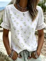 Close-up detail of white summer top with daisy print and elegant lace trim sleeves - 0XL / Tops / White