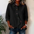 Detail of black irregular hem shirt with 3/4 sleeves and large buttons - S / Tops / Black