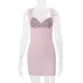 Vista dettagliata del mini abito rosa aderente con busto leopardato e bottoni frontali. - Taglia S / Vestiti / Rosa