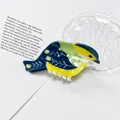 Detailed close-up view of a cute magpie-shaped PVC hair claw clip in vibrant blue and yellow - Cyan Hummingbird Style (LH-PVCZJ-3) / Large Claw Clip / Cyan