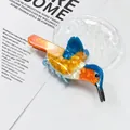 Detailed view of a vibrant bird-shaped hair claw clip with blue and orange marble texture - Orange Woodpecker Style (LH-PVCZJ-3) / Large Claw Clip / Orange
