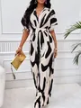 Elegant V-neck abstract print jumpsuit with batwing sleeves and wide leg design for women. - S / Black and White