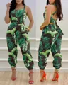 Tropical green palm leaf print halter jumpsuit with open back and bow tie detailing - S / Top And Bottom / Green Marijuana Leaf