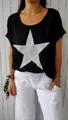 Detailed view of women's black cotton linen T-shirt featuring a glittery silver star design. - S / Tops / Black