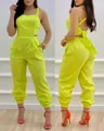 Vibrant neon green backless halter jumpsuit with bow detail and high waist design - S / Jumpsuits / Yellow