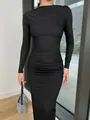 Close-up detail showing the ruched waist and slim fit of this black long sleeve dress - S / Dresses / Black
