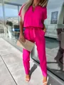 Elegant hot pink V-neck jumpsuit with short sleeves and belt, paired with high heels. - S / Jumpsuits / Rose Red