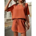 Completo da donna in maglia a nido d'ape arancione con top a pipistrello e pantaloncini - Cioccolato