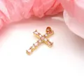 Detailed view of a gold cross pendant featuring sparkling pink and white zircons - Pendant Only (Without Chain) / Pink