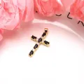 Detailed view of a gold-plated cross pendant featuring black and white cubic zirconia. - Pendant Only (Without Chain) / Black