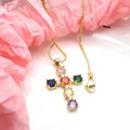 Close-up of gold-plated cross pendant with vibrant multi-colored cubic zirconia stones. - Necklace Set / Rainbow