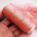 Close-up of 0.5mm flat waxed thread with metallic glitter for DIY jewelry making - 6-Strand / Starry Cloud Flat Waxed Cord (75830) / Coral Orange