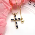 Close-up of gold-plated cross pendant featuring blue and white zirconia stones. - Top And Bottom / Pendant with Necklace / Dark Blue