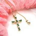 Detailed view of gold cross pendant featuring green pear-shaped cubic zirconia stones - Pendant Necklace Set / Green