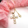 Detailed view of gold plated cross pendant necklace with sparkling round cubic zirconia - Necklace Set / White