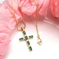 Close-up detail of a gold-plated cross pendant featuring green and white marquise zircons - Top And Bottom / Pendant with Necklace / Green