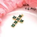 Detailed macro view of gold cross pendant with green and clear cubic zirconia stones - Pendant Only / Green