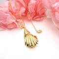 Macro view of an elegant gold seashell pendant on a dainty box chain necklace - Scallop Style Necklace (1) / Pendant and Necklace Set