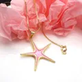 Elegant gold-tone copper necklace featuring a pink enamel starfish pendant for women - Pink Starfish Pendant Necklace