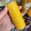 Detailed view of yellow wax thread with gold wire, 0.5mm cord for DIY jewelry braiding - 0.5mm / Yellow (XK08)