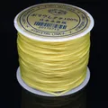 Rollo de hilo de cristal elástico plano amarillo para hacer joyas y pulseras DIY - 0.6mm / Amarillo