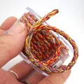 Makrodetail einer 3mm metallisch geflochtenen Drachenmuster Kordel für DIY Schmuck Basteln - Ca. 2,0 mm / Stil 1