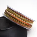 Nahaufnahme von 1,2 mm buntem Baumwollfaden mit Goldglitzer auf einer klaren Spule - 1.2mm / 03# Brown Green Orange White
