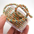 Detailansicht von 3 mm mehrfarbigem geflochtenem Drachenseil mit Goldfaden für DIY-Schmuck - Ca. 2,0 mm / Größe 11
