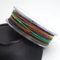 Detailed close-up of 1.2mm colorful glitter cotton thread for jewelry making and DIY - 1.2mm / 12# Red Yellow Green Blue Coffee