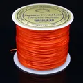 Cordón de cristal elástico plano naranja para la creación de joyas y pulseras de cuentas - 0.6mm / Naranja