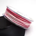 Close-up of 1.2mm glitter ombre cotton cord on a transparent spool for jewelry making - 1.2mm / 16# Pink Red White Gold Onion