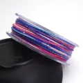 Macro detail showing texture of 1.2mm variegated cotton cord with sparkling metallic glitter - 1.2mm / 18# Blue Pink Purple White