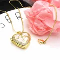 Close-up of a heart locket necklace featuring gold plating, zircon inlay, and pink enamel. - Pink + Necklace