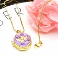 Detail of gold-plated hexagonal locket necklace with purple enamel and angel - White B + Necklace