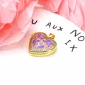 Detailed macro shot of a heart-shaped purple enamel locket inlaid with zircon stones. - Heart Pendant / White