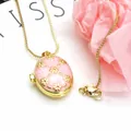 Macro view of gold-plated pink enamel locket necklace with delicate flower pattern - Necklace Set / Pink B