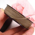 Macro detail of brown and gold braided Manbo cord for DIY jewelry bracelet making - Approx. 1.5MM / Khaki