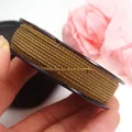 Detailed view of 1.5mm golden metallic Mambo cord for DIY bracelet weaving projects - Approx. 1.5MM / Brown & Yellow