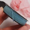 Close-up of blue and gold Mambo weaving cord showing high-density braided texture - Approx. 1.5MM / Light Blue