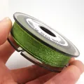 Macro detail of 0.85mm green phantom jade thread for DIY jewelry making crafts - Approximately 0.8mm / Tender Green