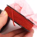 Red and gold 1.5mm braided mambo cord for DIY handmade jewelry crafts on a black spool - Approx. 1.5MM / Red