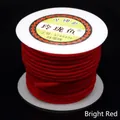 Close-up detail of 3mm bright red braided cord on a white spool for DIY jewelry projects. - 4mm / Red