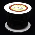 Macro detail showing the texture of dark coffee braided jewelry cord on a white spool - 4mm / Dark Coffee