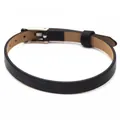 Detail view of a slim black leather bracelet with a silver adjustable metal buckle. - Silver Clasp / Black