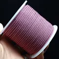 Spool of 2mm mauve braided corn cord for DIY jewelry making and craft necklace projects - Fuschia