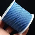 Durable 2mm blue braided nylon cord on spool for DIY jewelry making and crafts - Teal